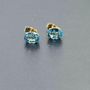 14K Yellow Gold Swiss Blue Topaz Stud Earrings 7x5mm Oval Cut Natural Gemstone